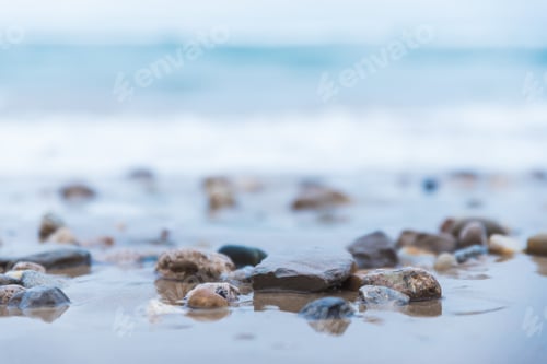 Preview: Closeup shot of pebbles in the water of the sea