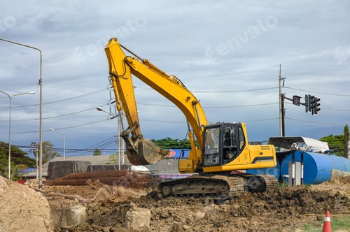 Preview: Yellow earthmover backhoe on soil at construction site