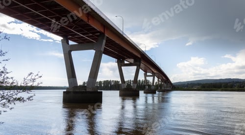Preview: Mission Bridge over Fraser River during Sunny and Cloudy Spring Season Day.