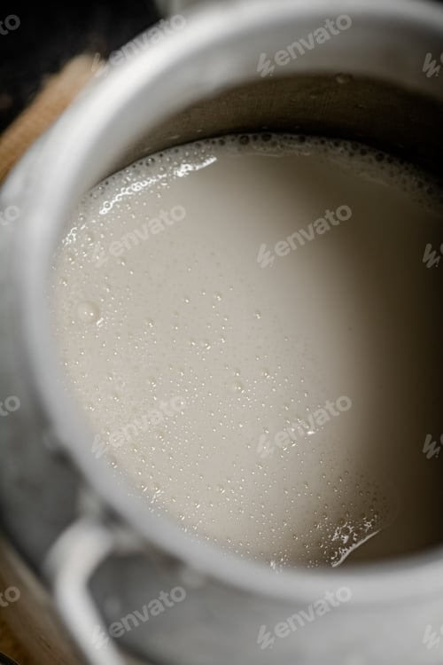 Preview: Village milk in a can. Macro background.
