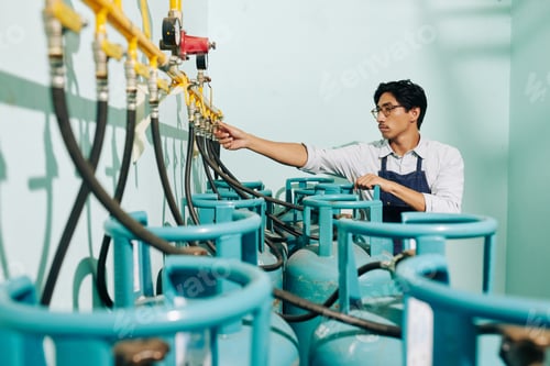 Preview: Worker attaching hoses to pipe