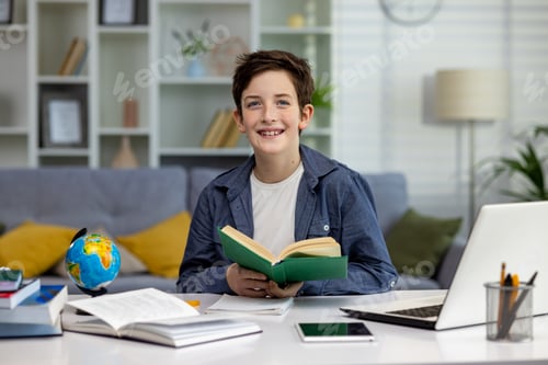 Preview: Portrait of young schoolboy at home, boy with braces on teeth is reaching and looking at camera