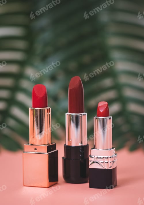 Preview: Red lipstick on a pink background with a palm branch.