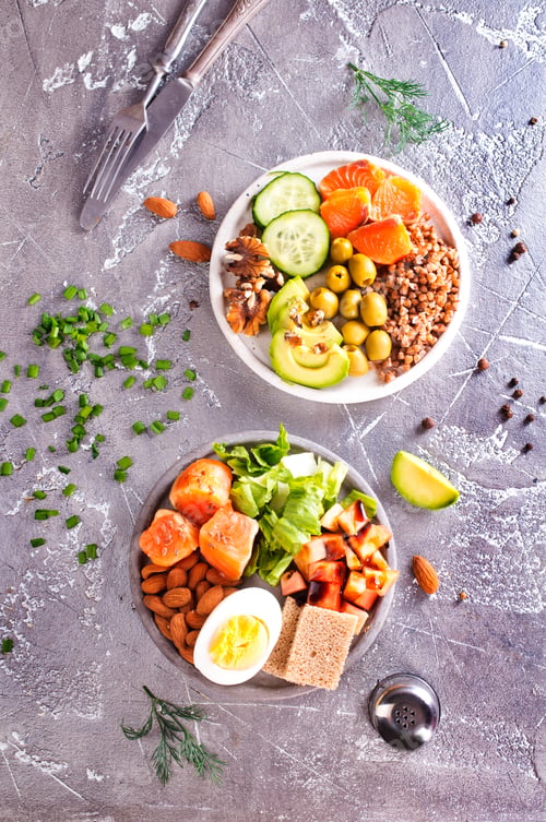 Preview: salad with salmon, boiled egg, bean, tomato, salad and almond nuts.