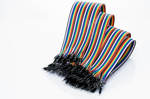 Preview: Ribbon cable or multi-wire planar cable on white background. Flat ribbon cable with pin connectors.
