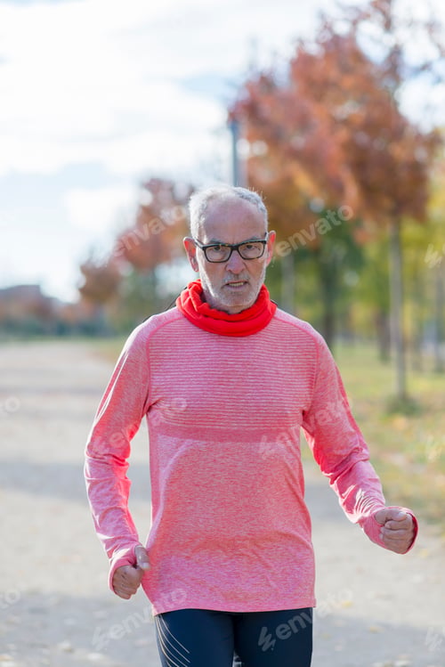 Preview: Senior retired man runs and performs exercise