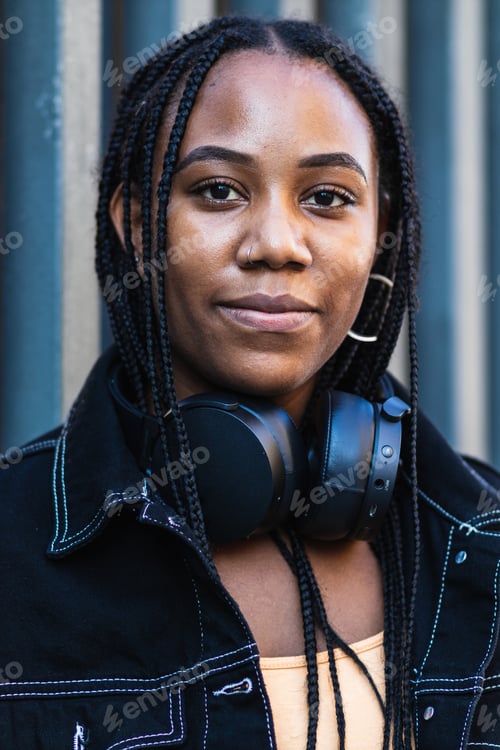 Preview: Black woman leaning on wall near park