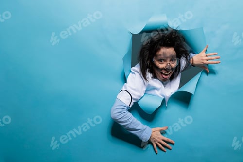 Preview: Foolish humorous scientist with comic expression on blue background