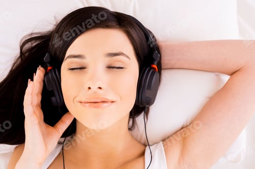 Preview: Woman enjoying music.