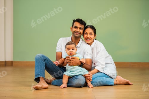Preview: Happy Family Smiling Together Sitting Indoors