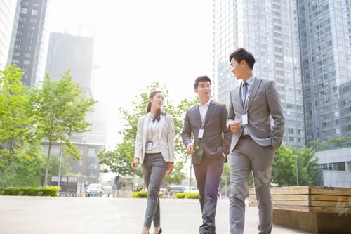 Preview: Young business person talking outdoors
