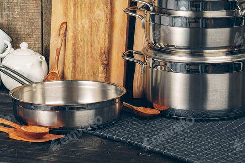 Preview: Set of stainless steel saucepans in a kitchen