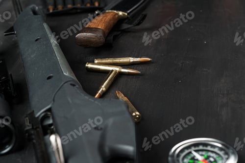 Preview: Hunting rifle and cartridges on dark wooden background