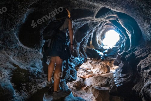 Preview: A young girl walking inside a dead tree in Sequoia National Park, California