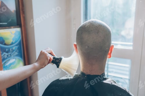 Preview: Woman barber cutting hair using razor