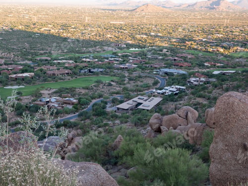 Preview: Aerial view of town in valley with mansions, roads, golf course in Fountain Hills, Arizona, USA.