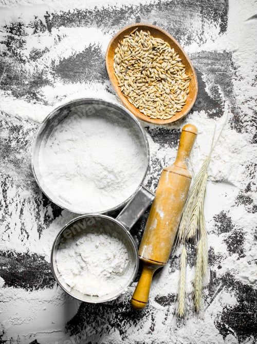 Preview: Flour in different sieve with grain, rolling pin and spikelets.
