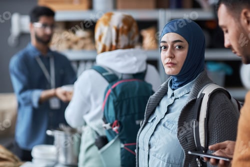 Preview: Middle Eastern Woman Looking at Camera at Refugee Help Center