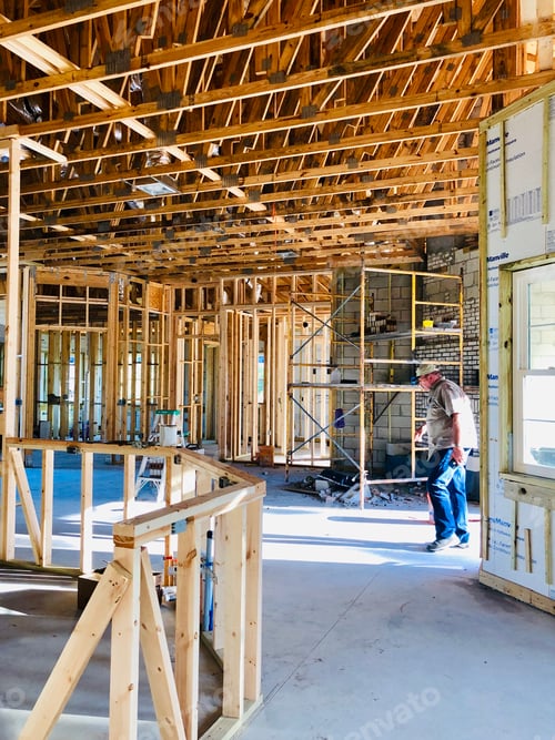 Preview: Homeowner walking into his new home still under construction.