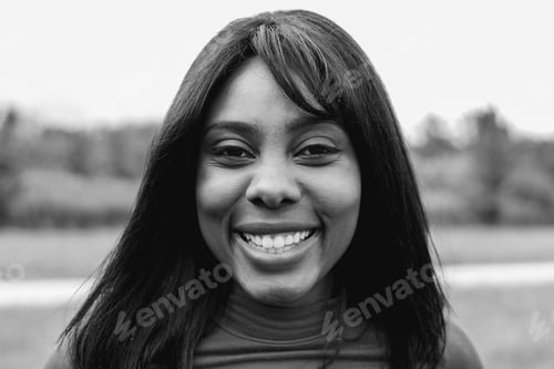 Preview: Happy hispanic young girl smiling on camera outdoor - Focus on face - Black and white editing