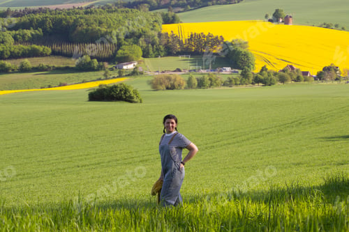 Preview: Happy woman enjoying gorgeous rural landscape in South Moravia region, Czech Republic