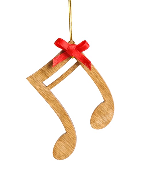 Preview: Wooden note with red bow isolated on white. Christmas music concept