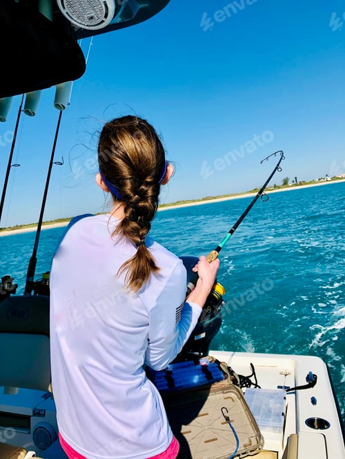 Preview: The fishing rod has a bend due to the fish trying really hard to swim away.
