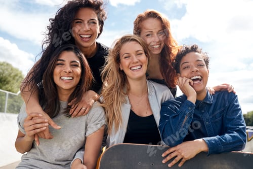 Preview: Portrait Of Female Friends With Skateboard In Urban Skate Park