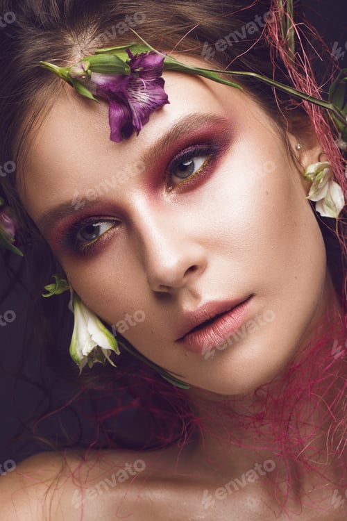 Preview: Beautiful girl with art make-up and flowers. beauty face.