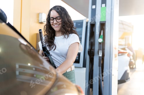 Preview: Woman fueling vehicle at gas station