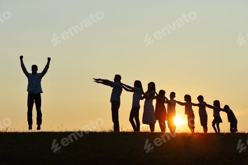 Preview: People Silhouettes On Summer Sunset Meadow Making Progress To Success