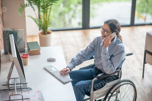 Preview: A disabled young woman talking on the phone