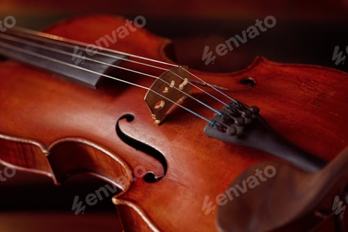 Preview: Violin in retro style and bow on wooden table