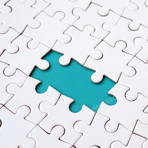 Preview: Close-up texture of a white jigsaw puzzle in assembled state with missing