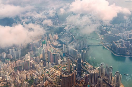 Preview: Aerial view through the clouds to a metropolis city of Hong Kong