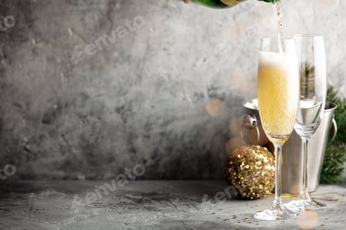 Preview: Champagne pouring into glasses and Christmas decorations