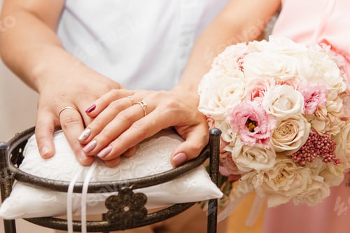Preview: Female and male hands close up. There are wedding rings on her fingers. The concept of the wedding.