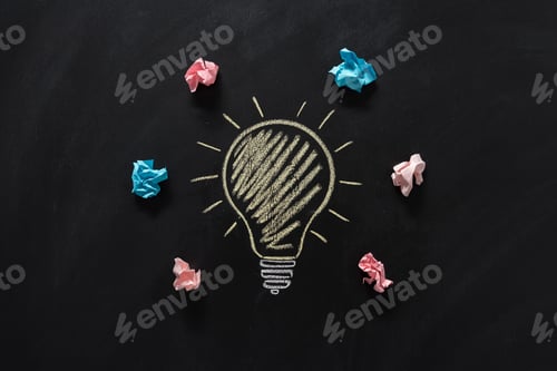 Preview: top view of paper rubbish lying around of electric bulb drawn on blackboard