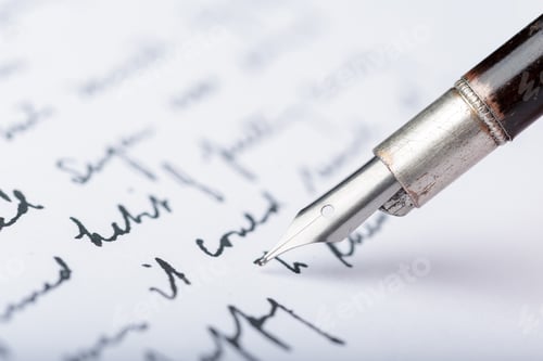 Preview: Writing with a fountain pen on paper during a quiet moment in an indoor space