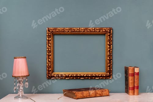 Preview: Empty gold rectangular vintage frame on a wall