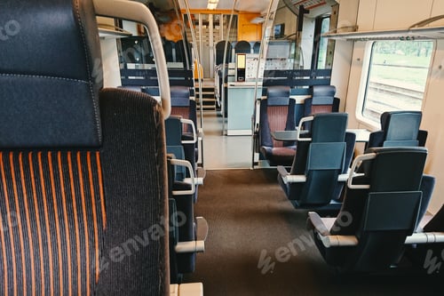 Preview: General view of a modern first-class train, seats and tables