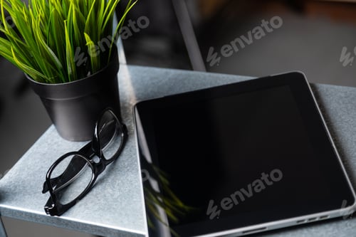 Preview: Tablet with a blank screen is on the table
