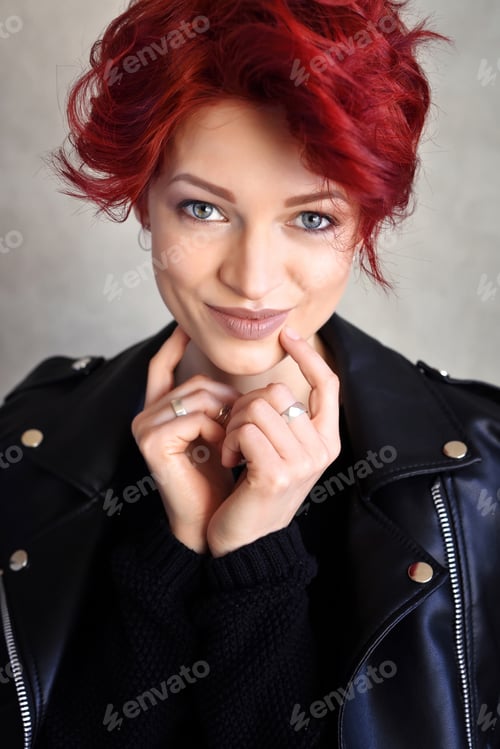 Preview: Portrait of a beautiful young red-haired woman with short hair l