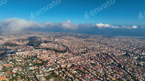 Preview: Aerial view of Barcelona City skyline above the clouds and fog, Catalonia, Spain