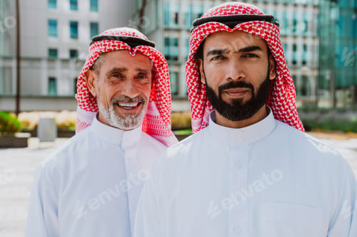 Preview: Arab entrepreneurs discussing business outside modern building