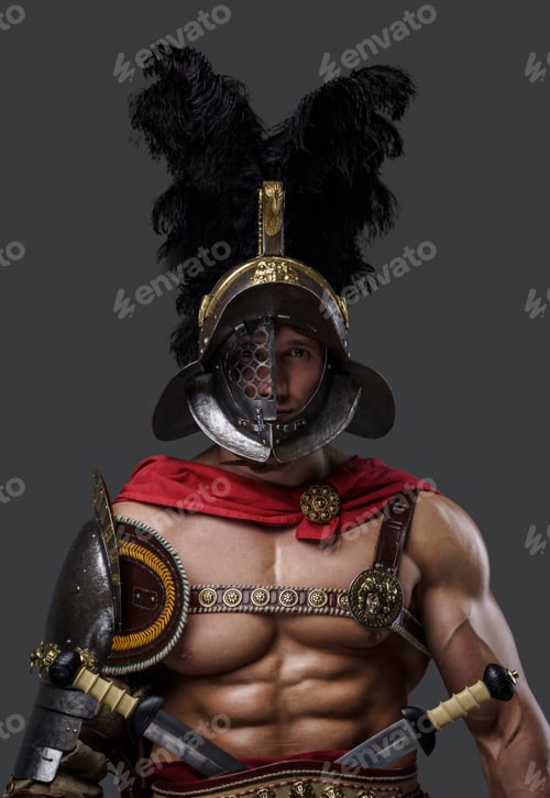Preview: Muscular roman gladiator looking at camera against grey background