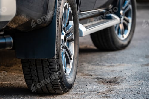 Preview: Closeup of parked car on a city street side