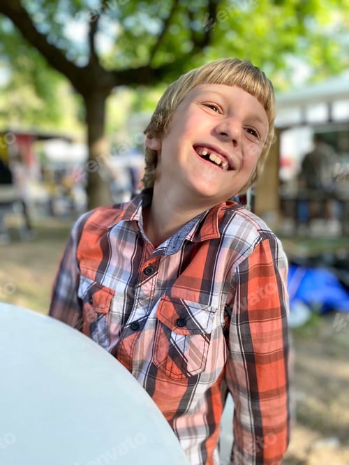 Preview: 9 years old blonde Caucasian boy laughing