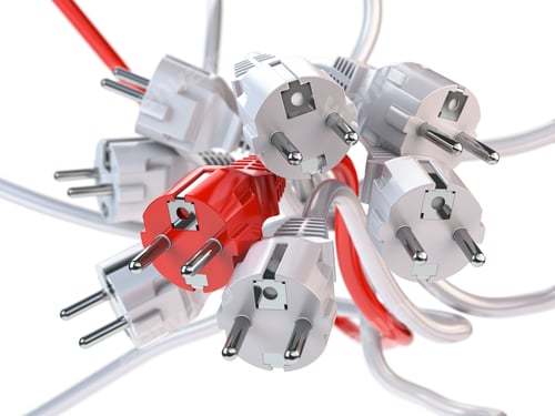 Preview: Unique red electric plug in the heap of a white plugs. Leadershi