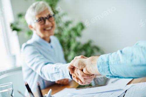 Preview: business woman senior office hand shaking meeting agreement handshake partnership success contract